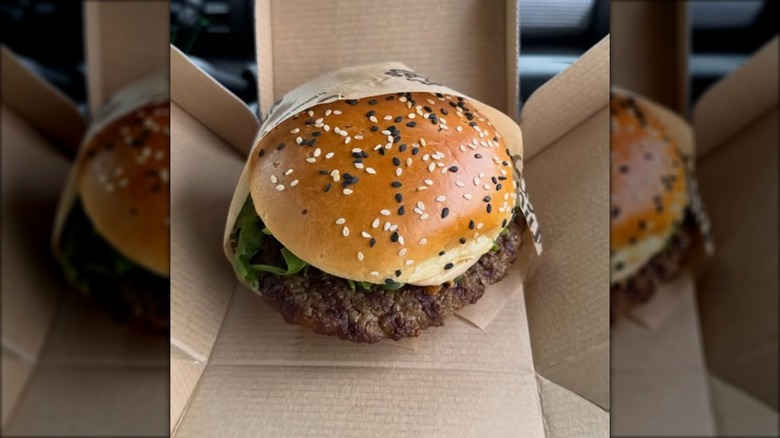 burger king wagyu burger in cardboard container