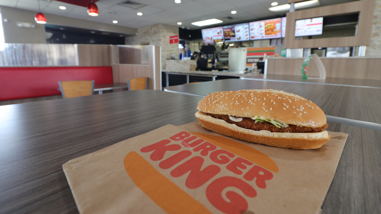 Burger King chicken sandwich on paper bag, closeup