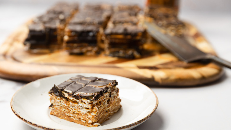 One slice of 3-ingredient passover matzo cake before the rest of the cake