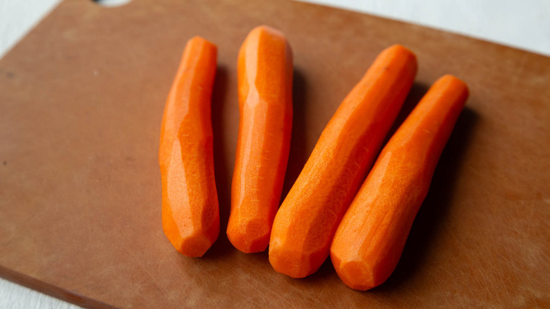 peeled carrots on cutting board