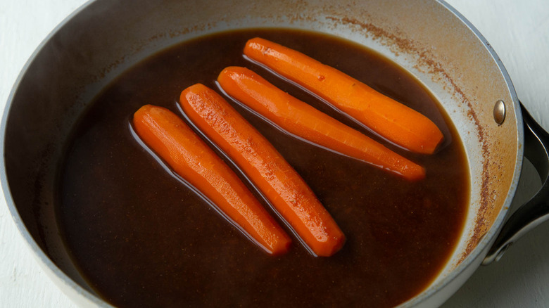 cooked carrots in seasoned broth