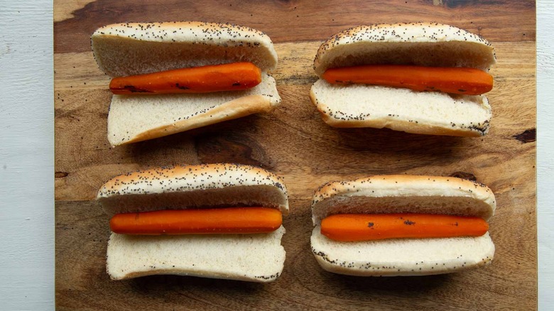 cooked carrots in hot dog buns