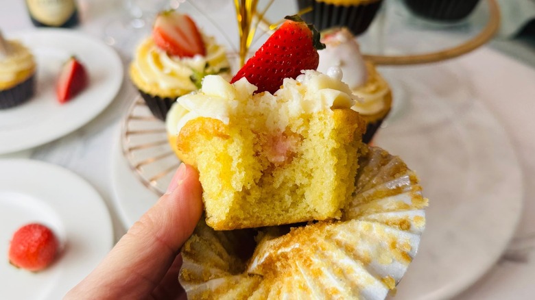 Champagne cupcake with bite taken