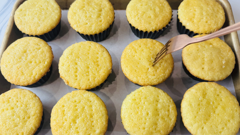fork sticking out of a yellow cupcake