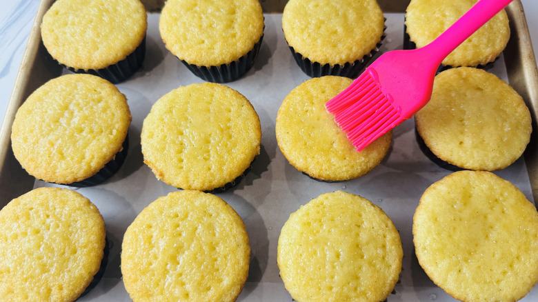 rubber brush painting a yellow cupcake