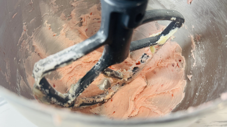 pink frosting in a stand mixer