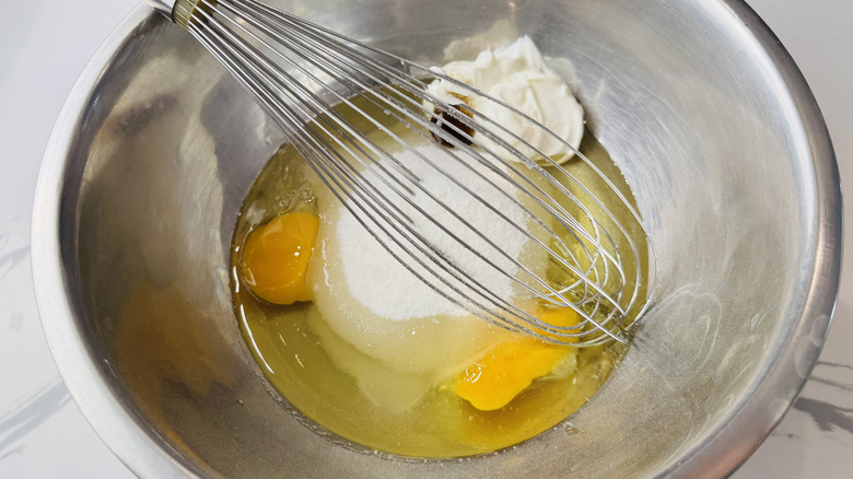 eggs and sour cream in a metal bowl