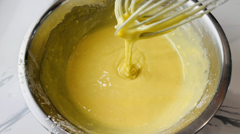 yellow batter in a metal bowl
