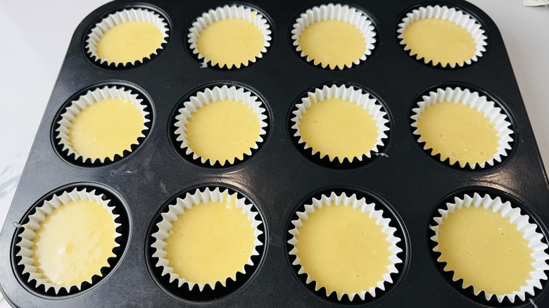 yellow batter in a muffin pan