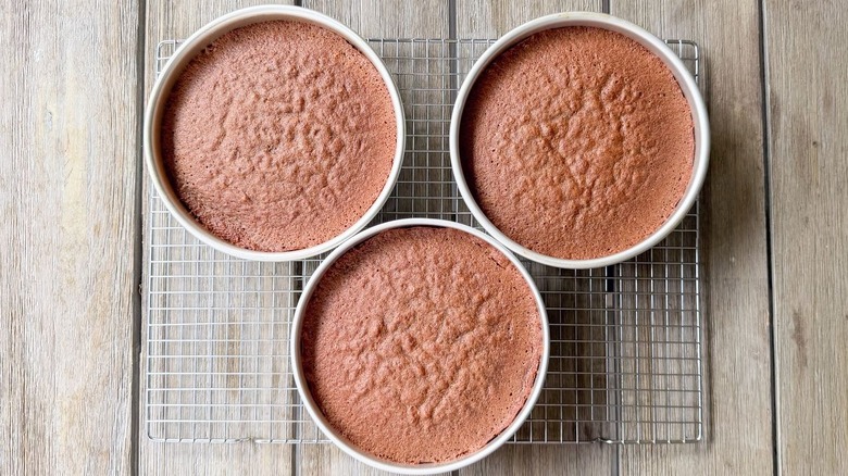 German chocolate cake layers cooling in pans on table