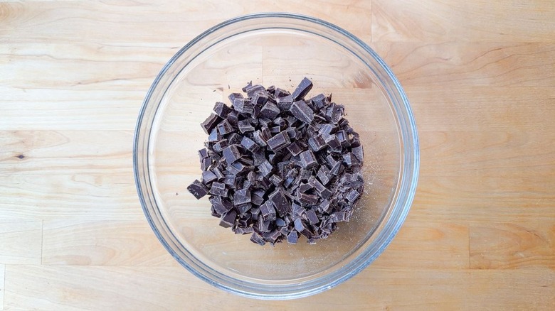 Chopped chocolate chunks in glass bowl
