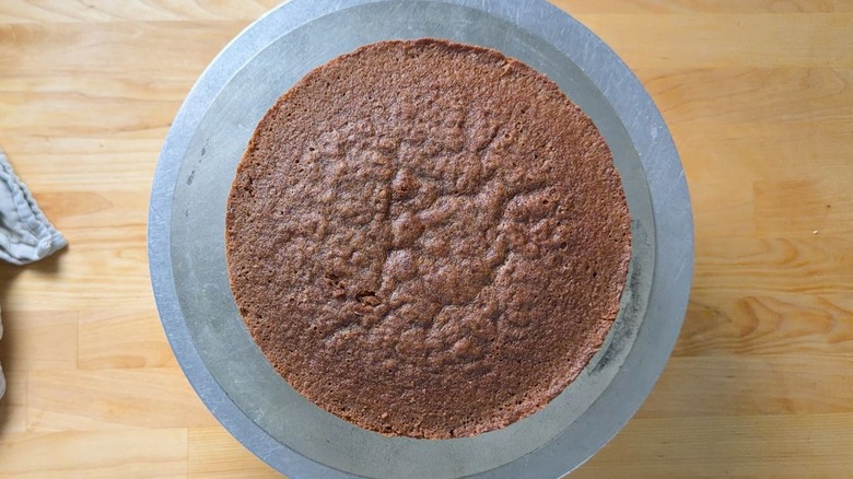 German chocolate cake layer on cake stand