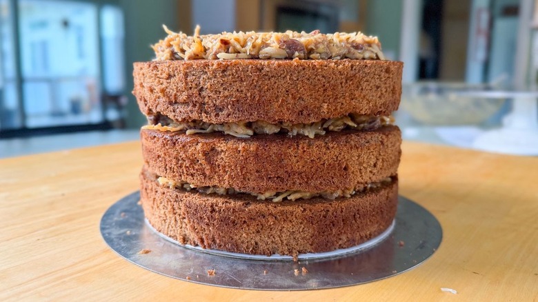 Assembled German chocolate cake on countertop