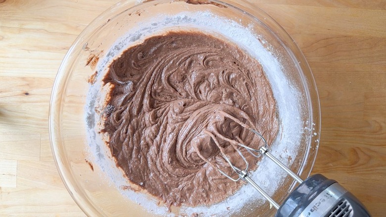Using hand mixer to mix traditional German chocolate cake batter