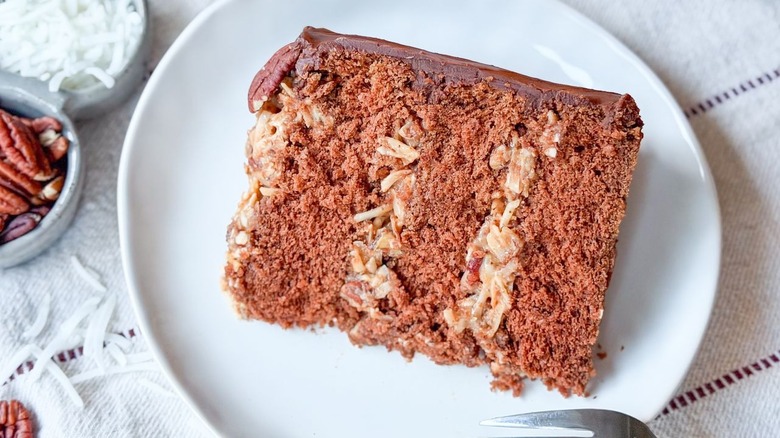 Slice of traditional German chocolate cake on plate
