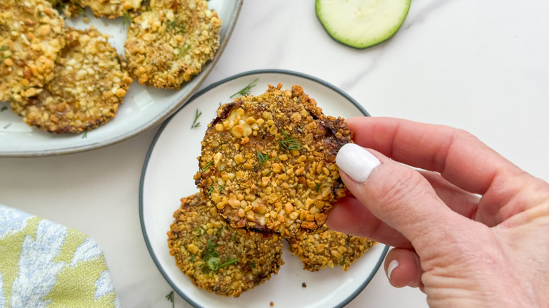 hand holding zucchini chip