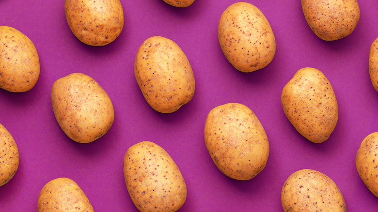 potatoes against a purple background