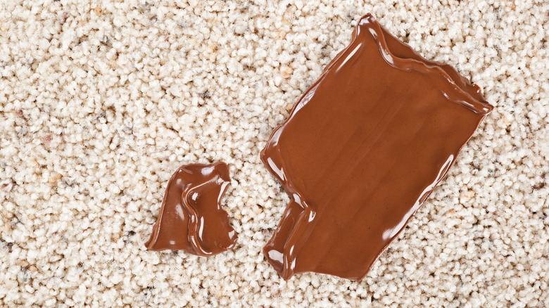 Melting Chocolate bar on white carpet