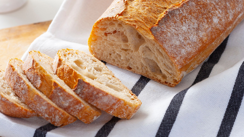 Refreshed homemade sourdough bread loaf and slices