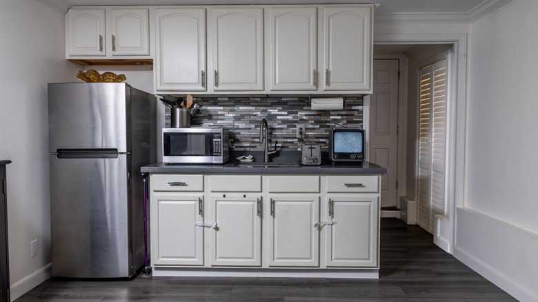 small apartment kitchen with minimal storage space
