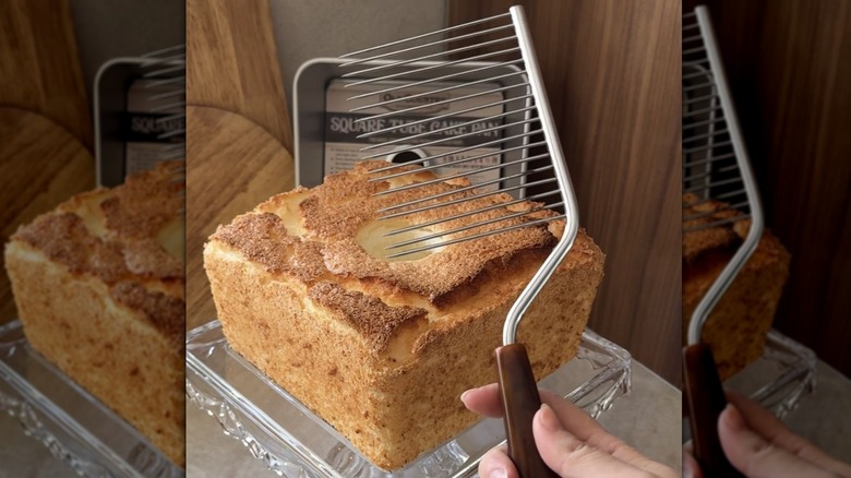 Somone holding a cake breaker