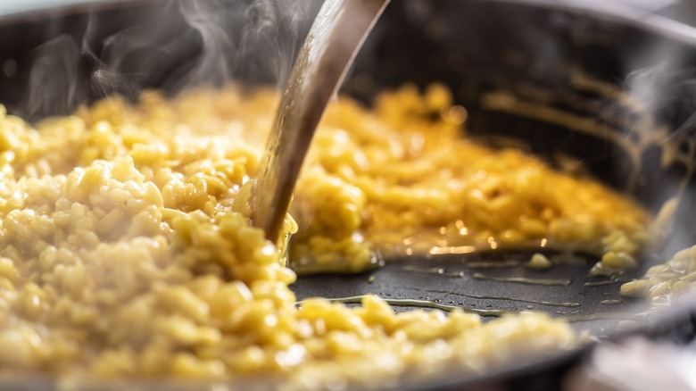 cooking risotto in pan