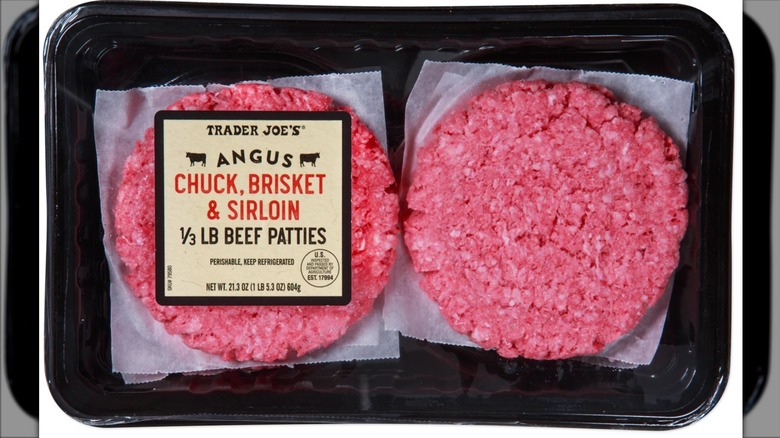 package of raw burger patties with paper between