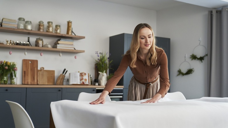 woman setting a kitchen table