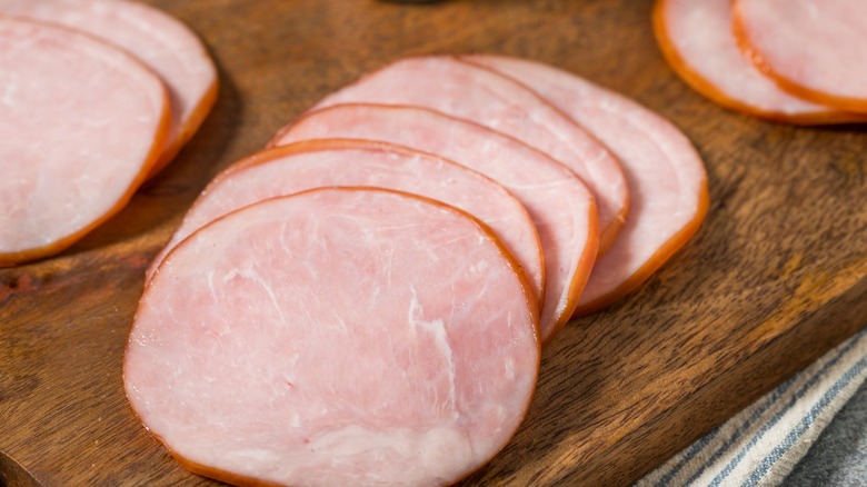 canadian bacon rounds on a cutting board