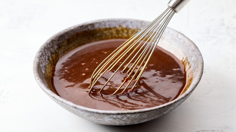 hoisin sauce with whisk in small bowl