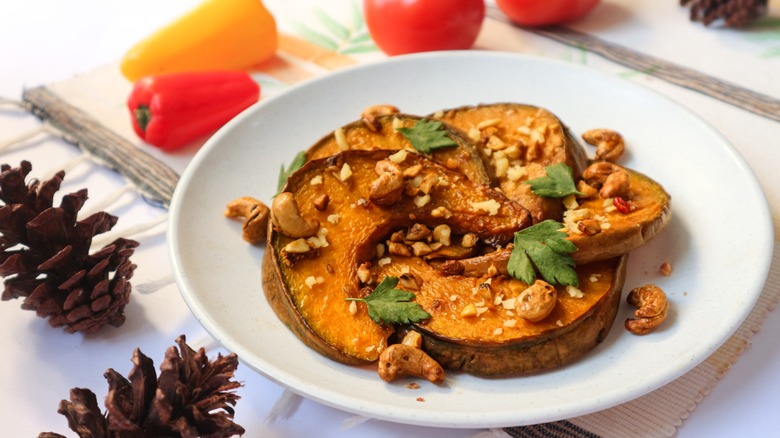roasted pumpkin slices with nuts and herbs