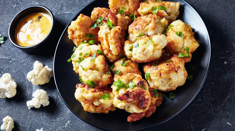 breaded and fried cauliflower with dressing