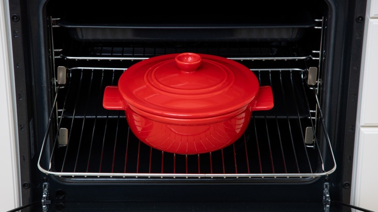 covered dutch oven on oven rack