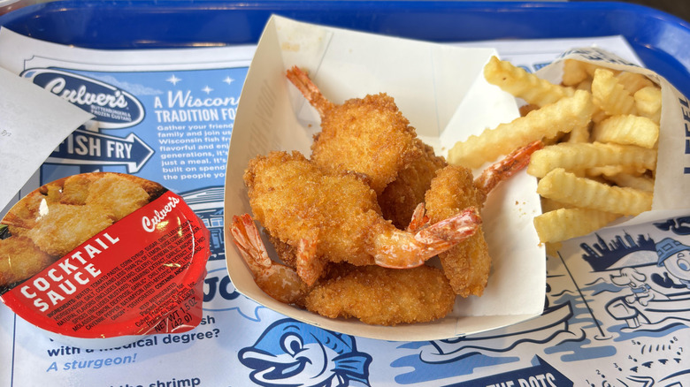 Culver's jumbo shrimp alongside fries and container of cocktail sauce