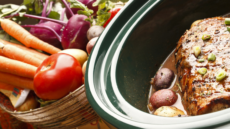pork in slow cooker and veggie basket
