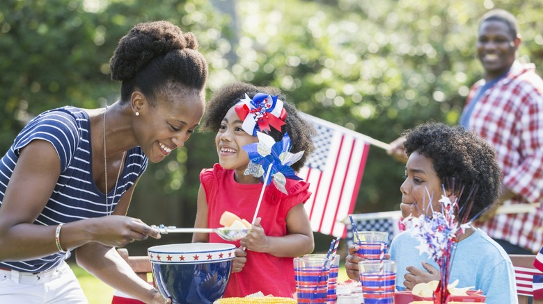 a family enjoys a patriotic memorial day bbq