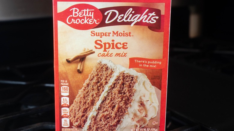 box of betty crocker spice cake mix with black background