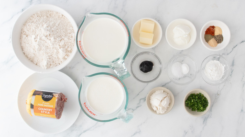 Overhead shot of ingredients needed to make buttermilk biscuits and sausage gravy