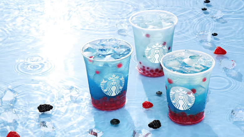 boba teas in shallow pool of water