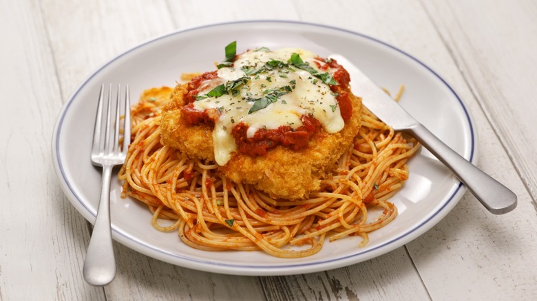 chicken parm on plate with pasta