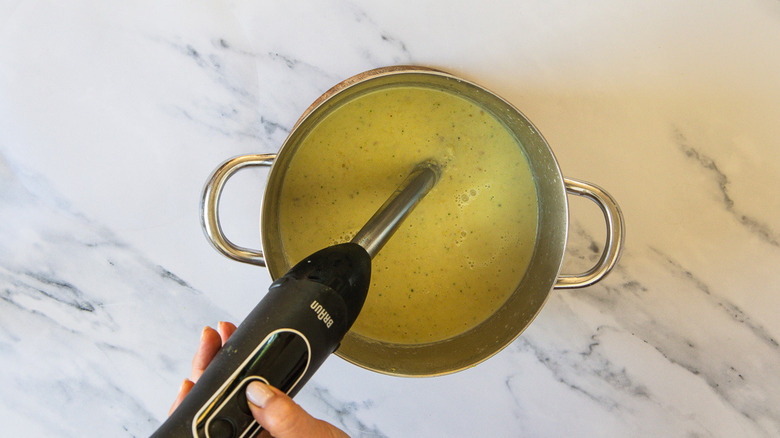 Blending soup with immersion blender
