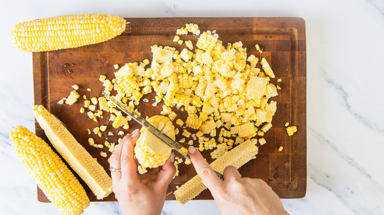 Cutting corn off cobs on board