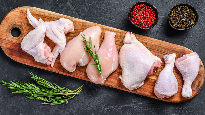 Fresh raw chicken meat on a wooden block