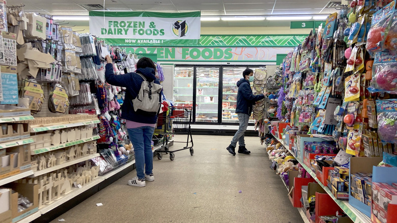 Customers shopping inside a Dollar Tree.