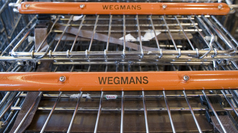 Closeup of Wegmans-branded shopping cart handles