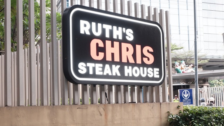 sign for ruth's chris steakhouse on fence