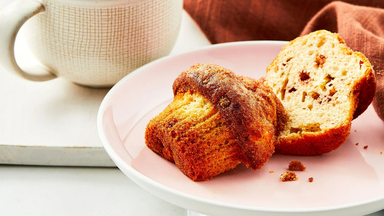 Plate with apple cinnamon muffin cut on half