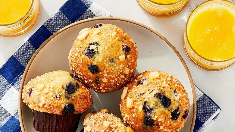 Plate with four lemon blueberry muffins