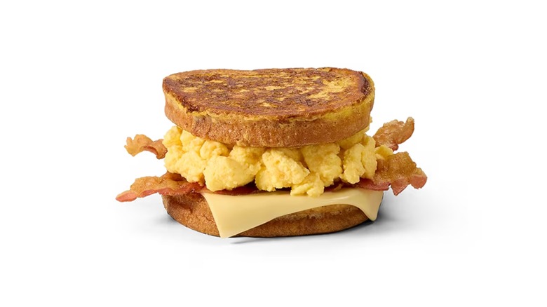 scarmbled eggs, bacon, and cheese on french toast