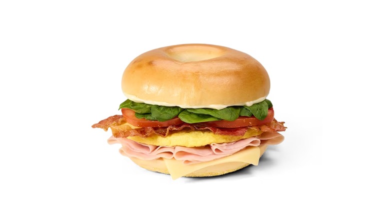 bagel sandwich with ham and tons of toppings